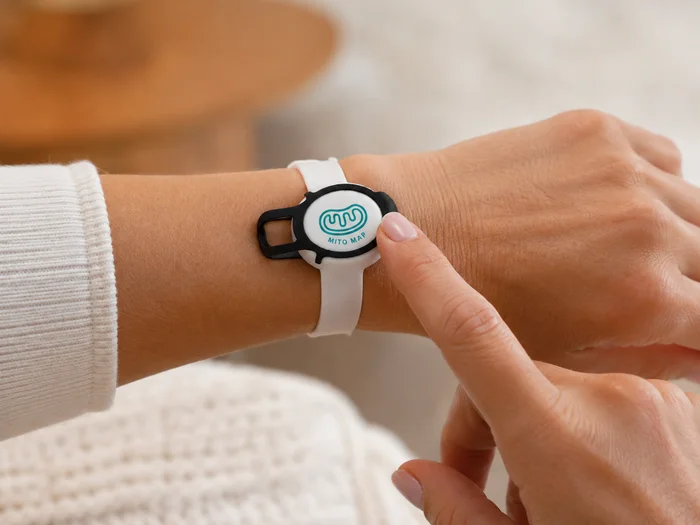 Wrist use case: a person pressing a wrist-worn Flic 2